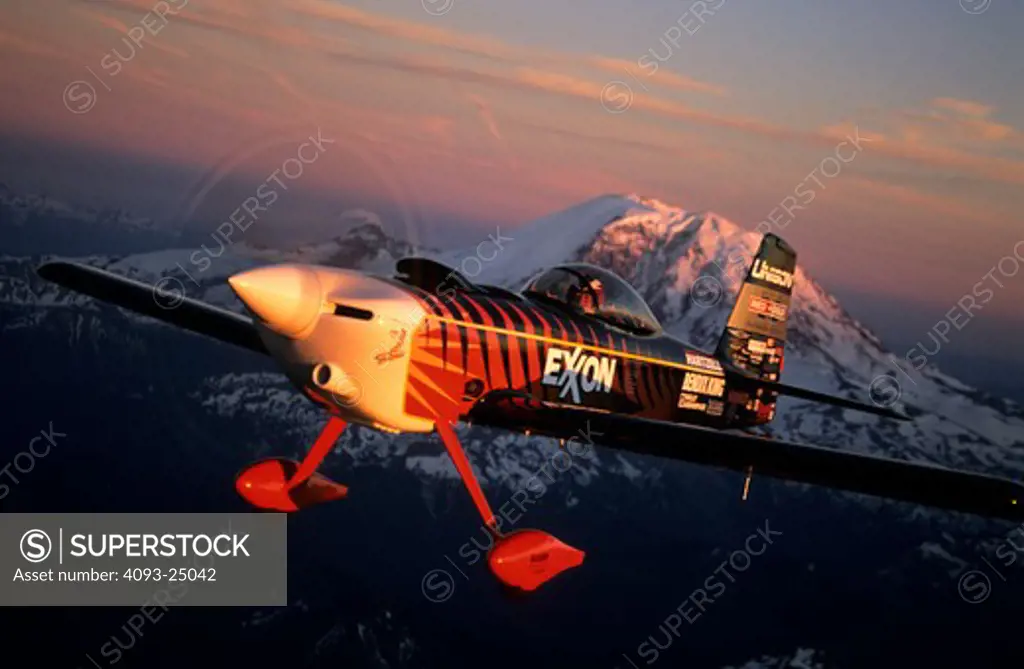 Bruce Bohannon flying his Exxon Flyin' Tiger. in which he has set more than 24 time to climb and altitude records nearing 50 000 feet altitude Air to air photos taken near Mount Rainier  WA. One of a kind airplane based on a Vans RV-4