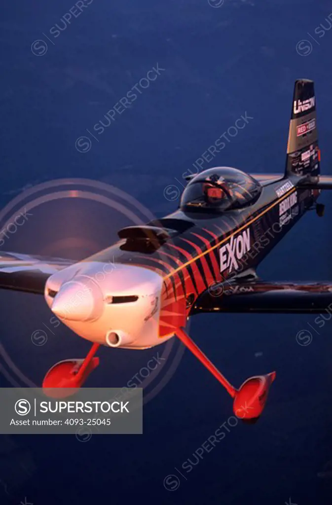 Bruce Bohannon flying his Exxon Flyin' Tiger. in which he has set more than 24 time to climb and altitude records nearing 50 000 feet altitude Air to air photos taken near Mount Rainier  WA. One of a kind airplane based on a Vans RV-4