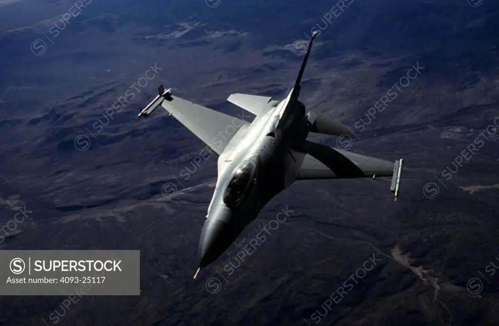 USAF Lockheed F-16C Fighting Falcon (Viper) over a mountain/desert background