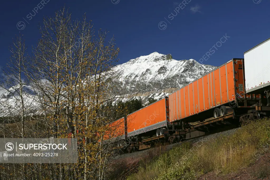 Burlington Northern Santa Fe intermodal train  passing thru Glacier Park near  Essex Montana