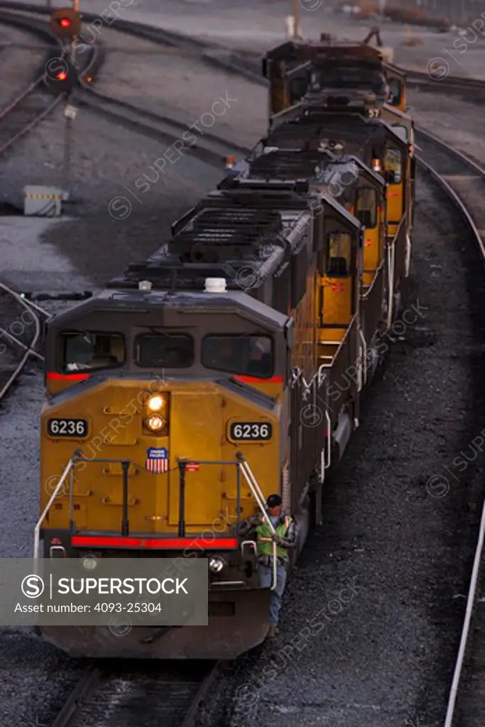 Diesel locomotives move through Union Pacific's West Colton freight yards in Colton California on their way to their next assignment. Train passing through in motion