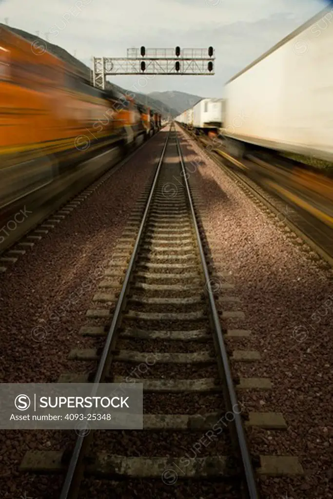 Blurred action of a BNSF freight locomotive passing on the right and left, point of view