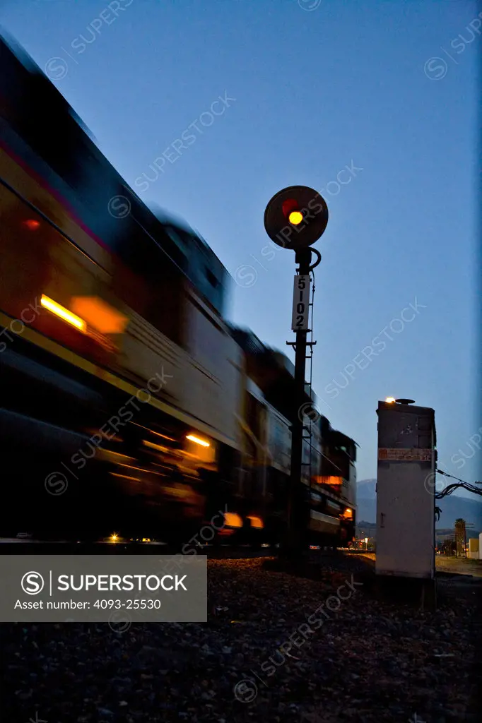 An eastbound  Union Pacific freight train speeds thru Walnut, Calif.