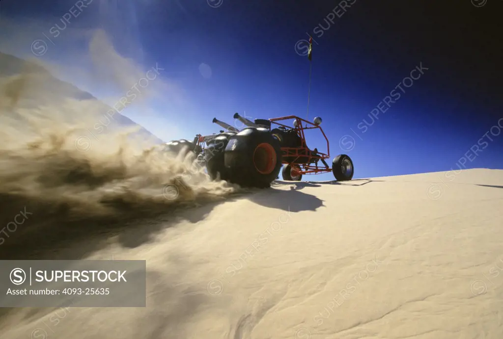 low angle dune buggy sand rail red sand unusual dust