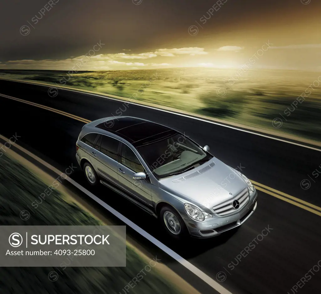 2006 Mercedes Benz R Class Multipurpose Vehicle driving on road at sunset