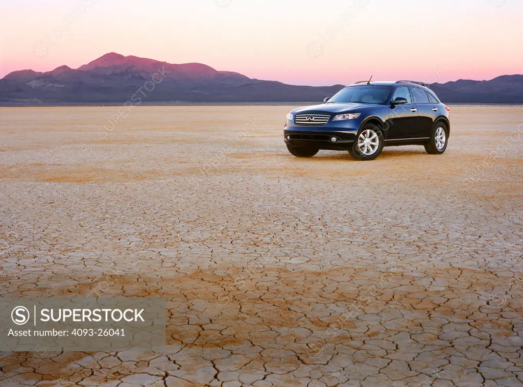 2004 Infiniti FX35 FX 35 parked in the desert flatlands with mountains rockies in the back background very colorful