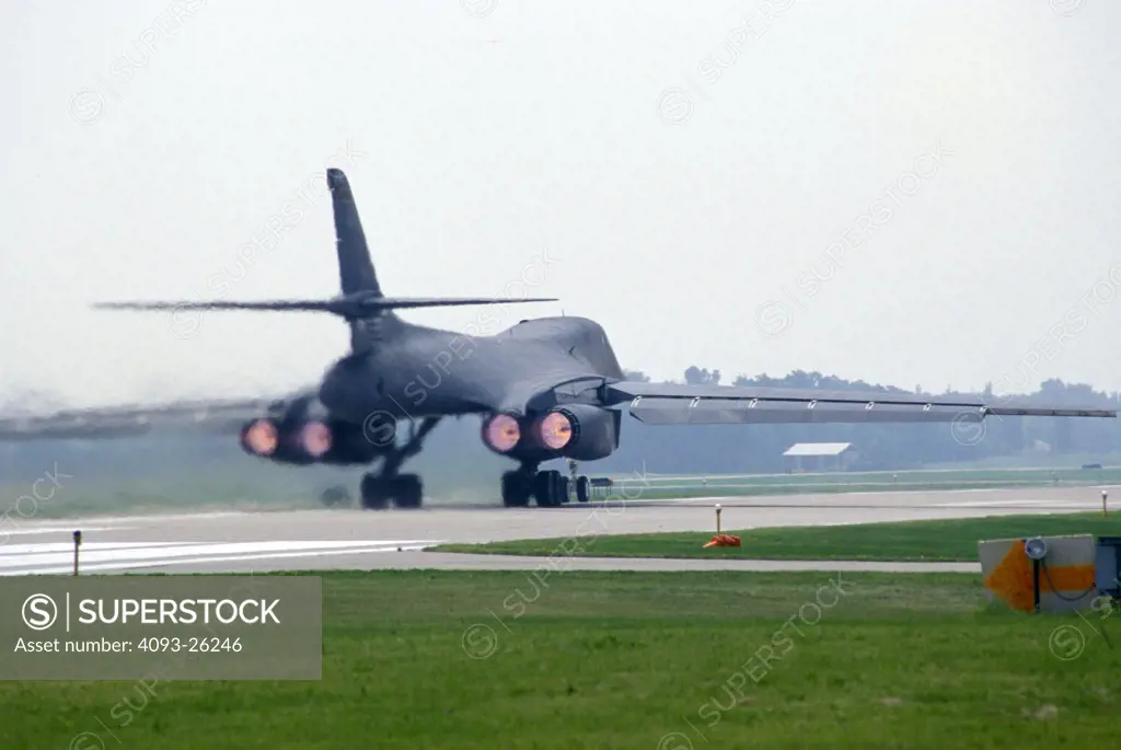 Military Jets Fixed Wing Boeing Aviat Airplanes B-1B Lancer bomber taxiing heat runway