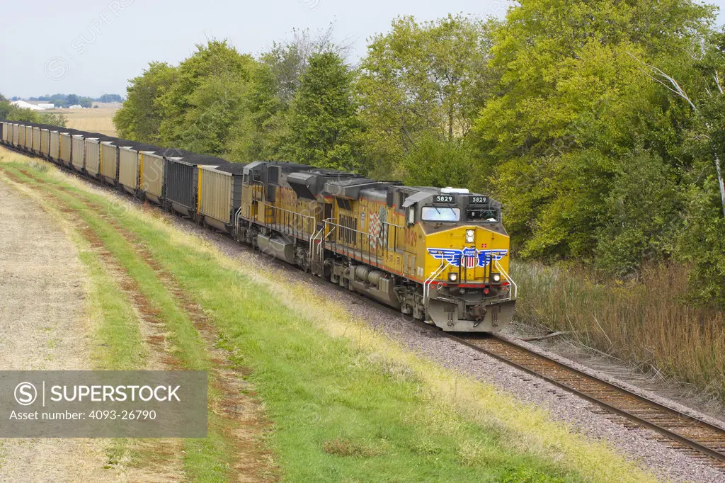 UP5829 Coal Train w/ two locomotive consist, south bound, Akron, IL on Peoria UP subdivision General Electric C44AC-CTE, grain elevators, rural setting, harvested bean & corn fields