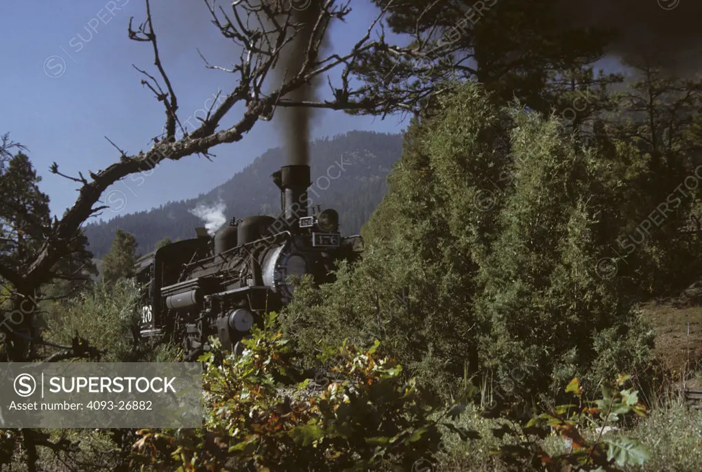 1944, Durango and Silverton Steam Locomotive traveling through forest