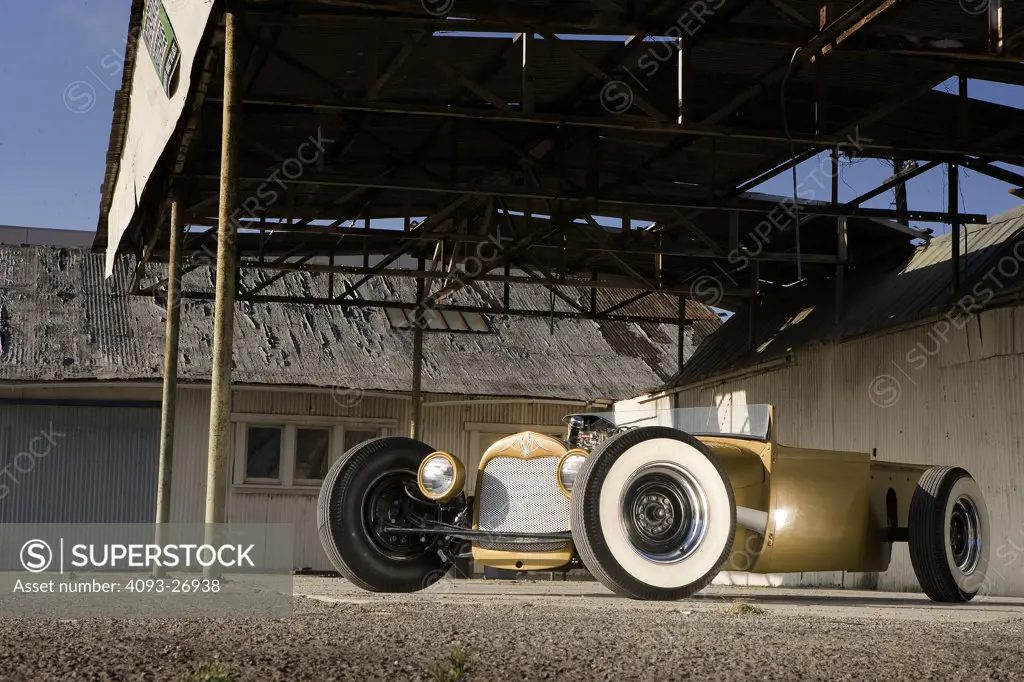 1929 Chevrolet low rider hot rod custom modified roadster pickup with the name brokesville, at abandoned service station broken down garage