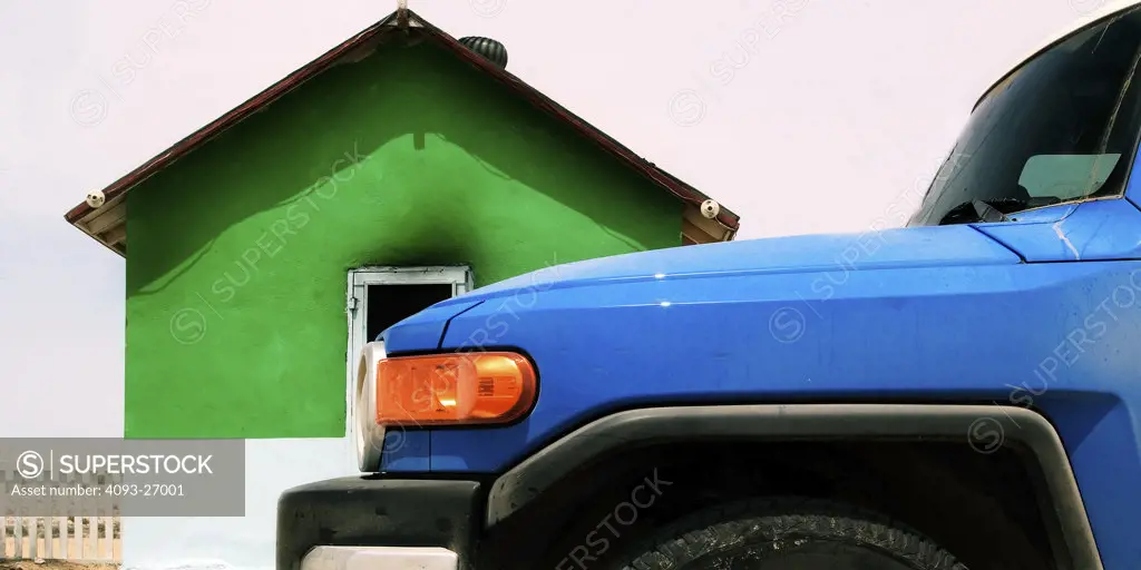 2007 Toyota FJ Cruiser, offrooading in baja california. small church buildings with solid colors, a fence and lots of character.
