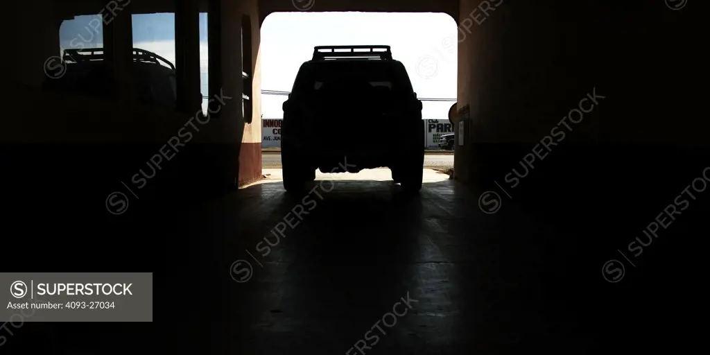 2007 Toyota FJ Cruiser, offrooading in baja california. Stopped in a garage with the door open and its silhouette.