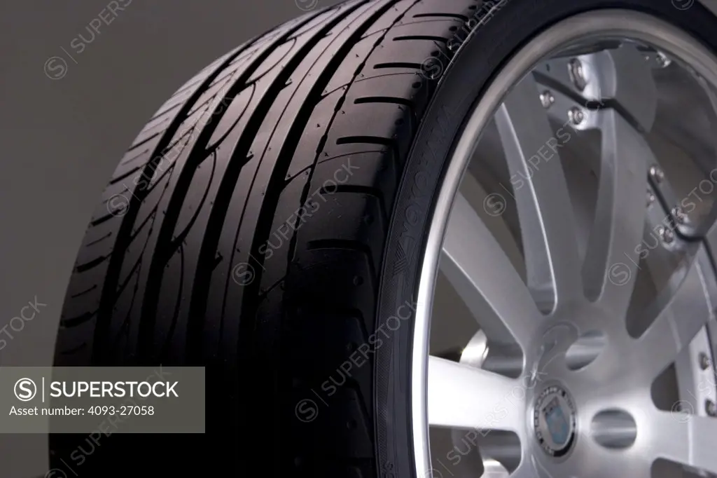 in studio close up shot of 22 inch rims with Yokohama tires.