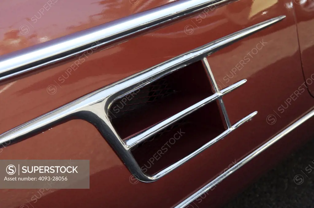 A close up detail shot of a 1960 Cadillac side vent