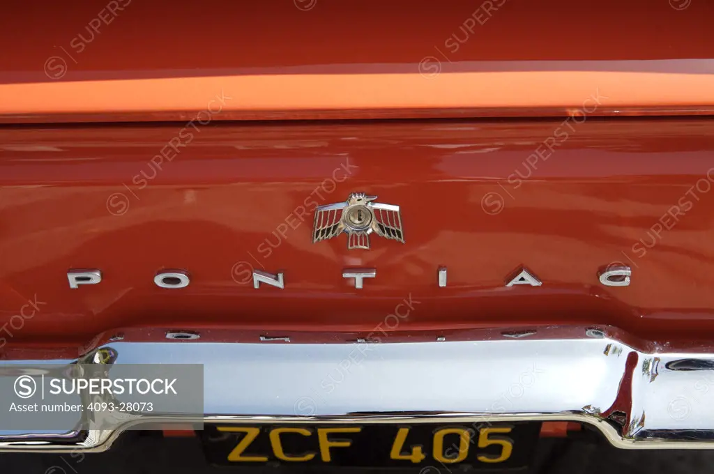 A close up detail shot of a 1940 Pontiac Firebird tail logo and license plate
