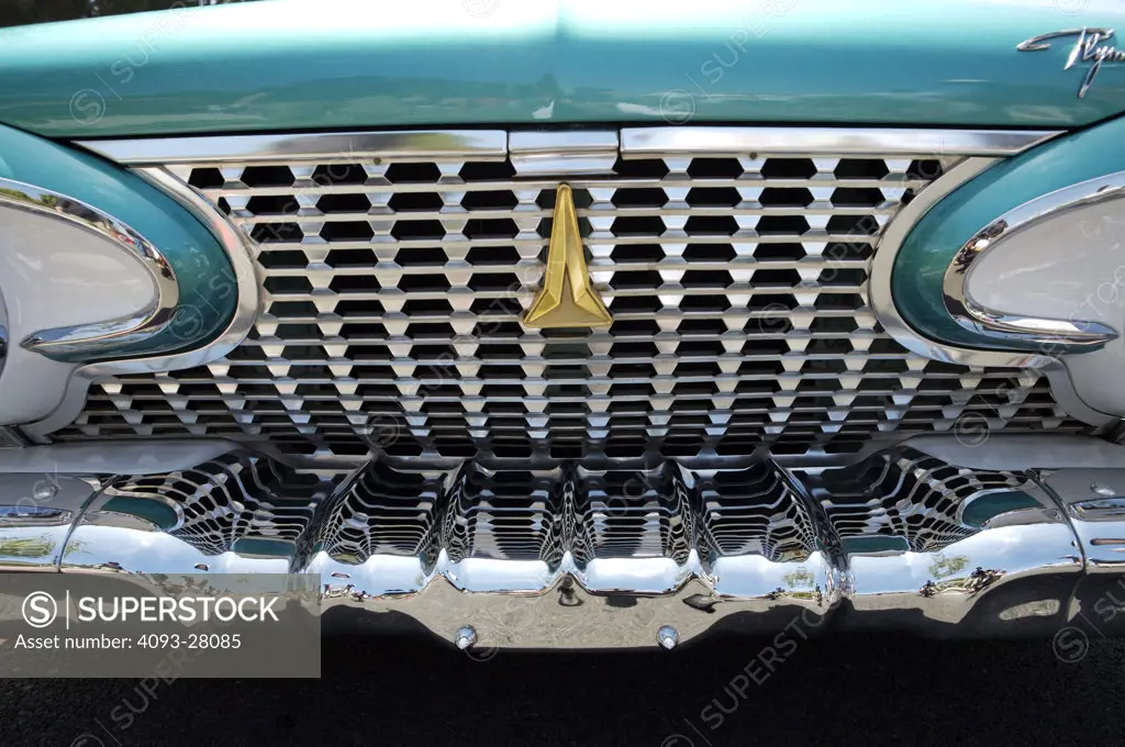 A close up detail shot of an old Plymouth front grill