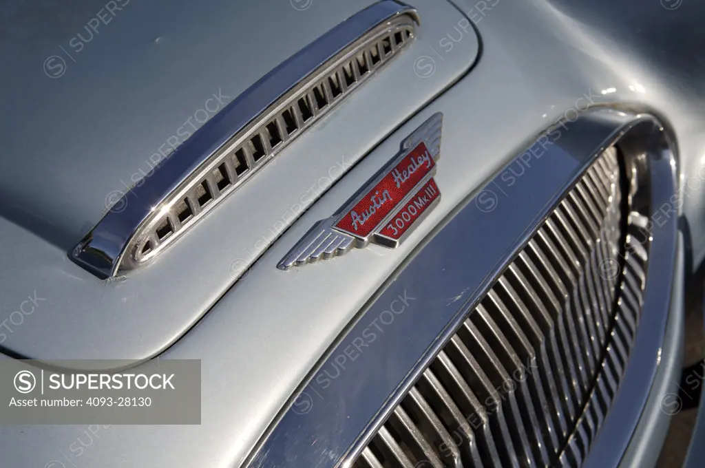 A close up detail shot of a 1967 Austin Healey 3000 hood and grill