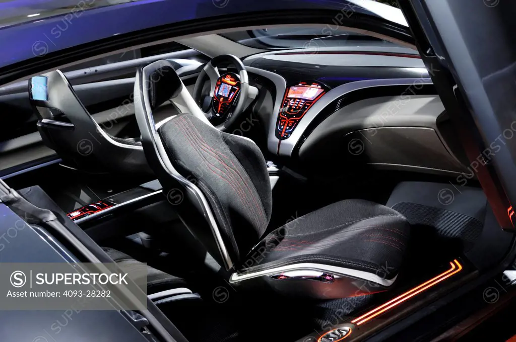 Futuristic interior view of the 2012 Kia KUE concept car Showing the steering wheel, center console, dashboard and front seats