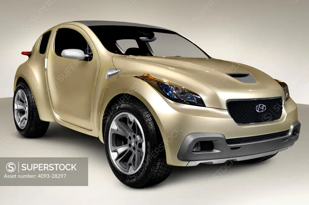 Front 3/4 static of a gold 2009 HCD10 Hyundai Hellion Concept Car in the studio
