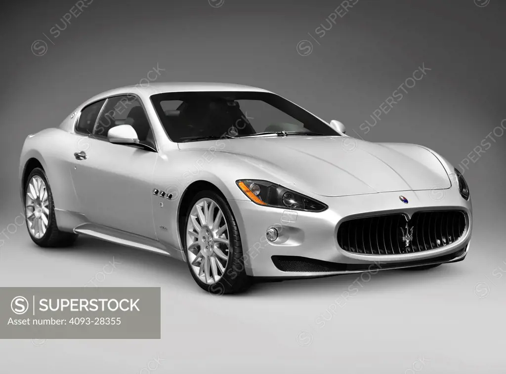 Front 3/4 static of a 2010 Silver Maserati GranTurismo two-door coupe luxury car in the studio