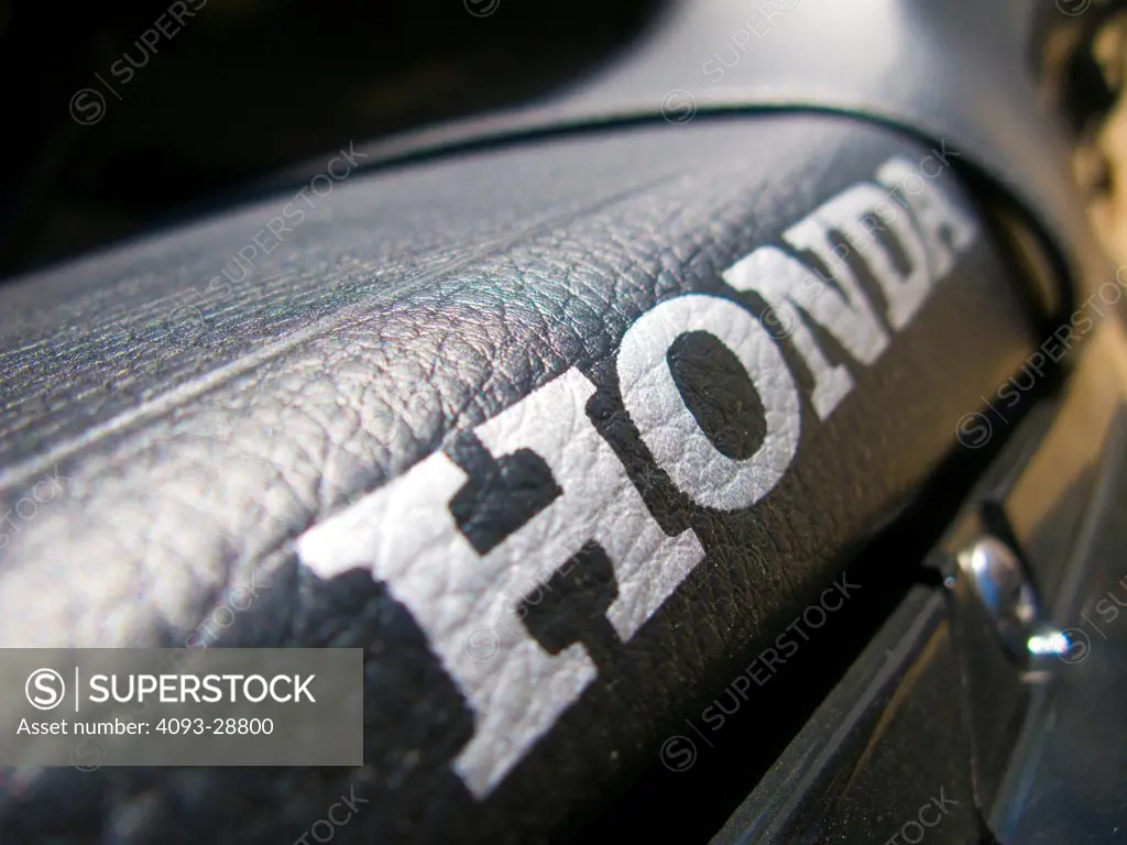 2009 Honda CRF230M close-up on seat with logo