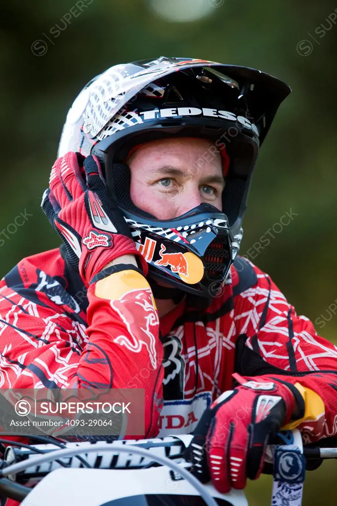 2008 Honda CRF 450R with rider Ivan Tedesco on dirt track course in forest