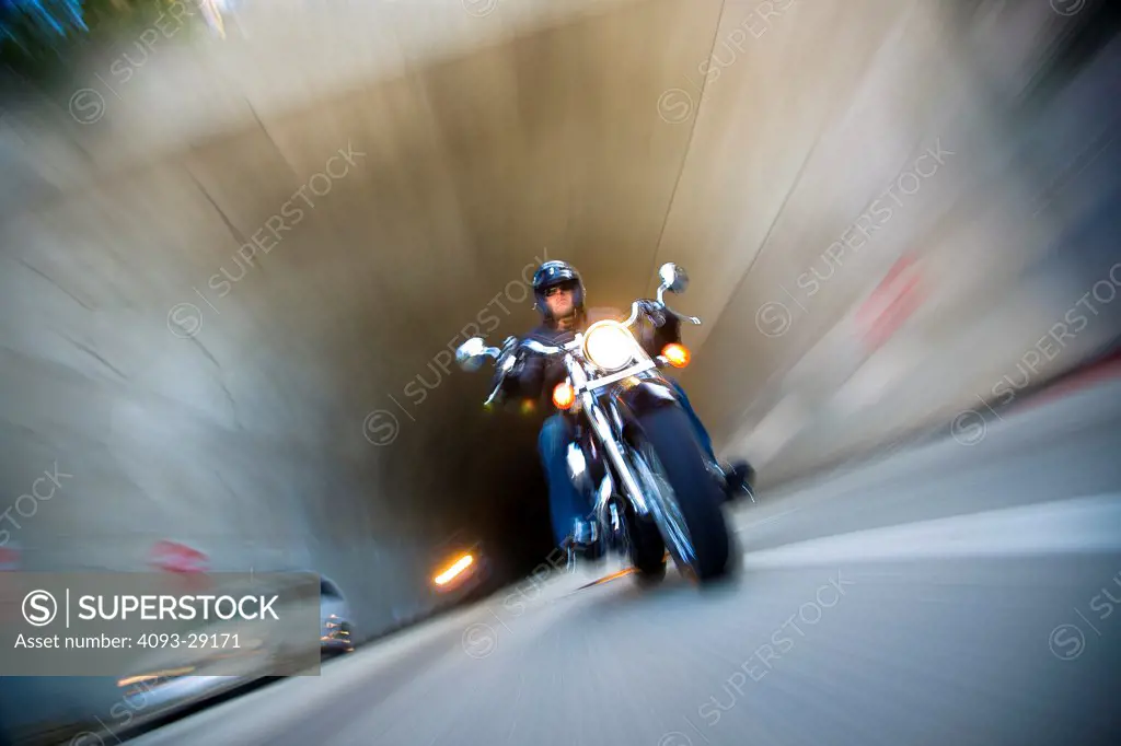 2008 Honda VTX 1300 on urban road leaving tunnel, front 3/4