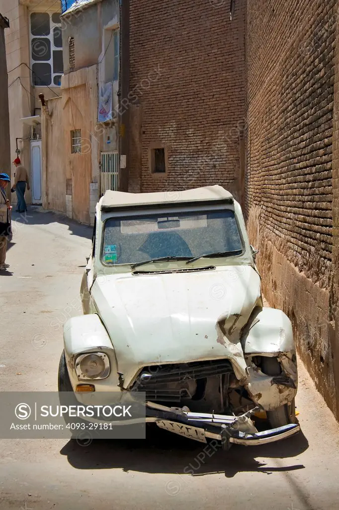1966 Citroen 2CV parked in a back alley in Iran