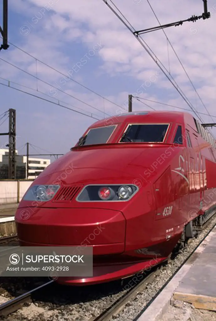 TGV high speed train red Thalys Belgium power lines street