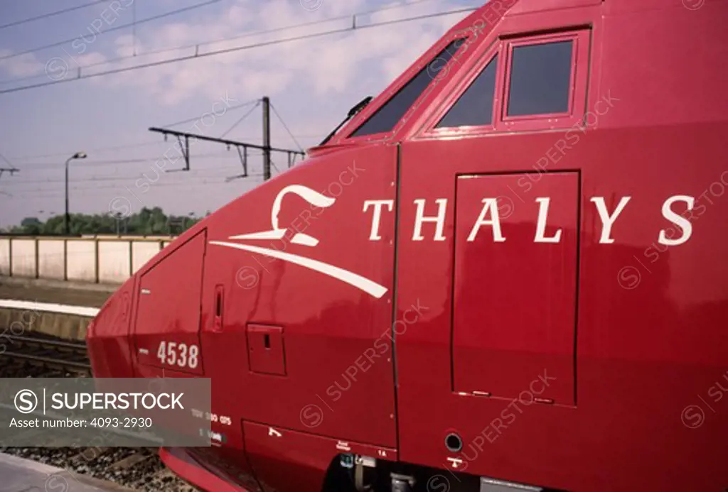 TGV high speed train red Thalys Belgium power lines street