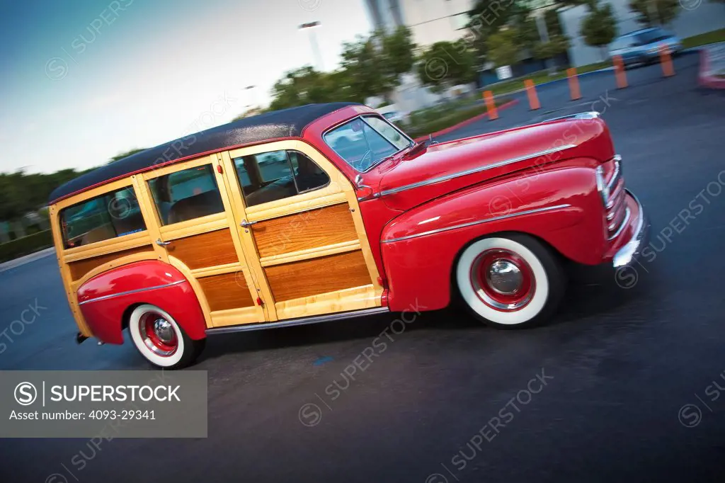1948 Ford Woody station wagon in parking lot, front 7/8