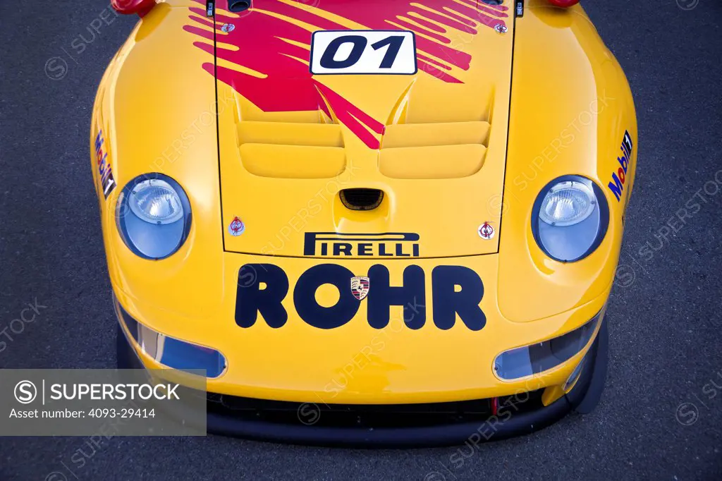 Straight on nose detail view of the yellow 1997 Porsche GT1 race car. Raced in the IMSA GT racing series.