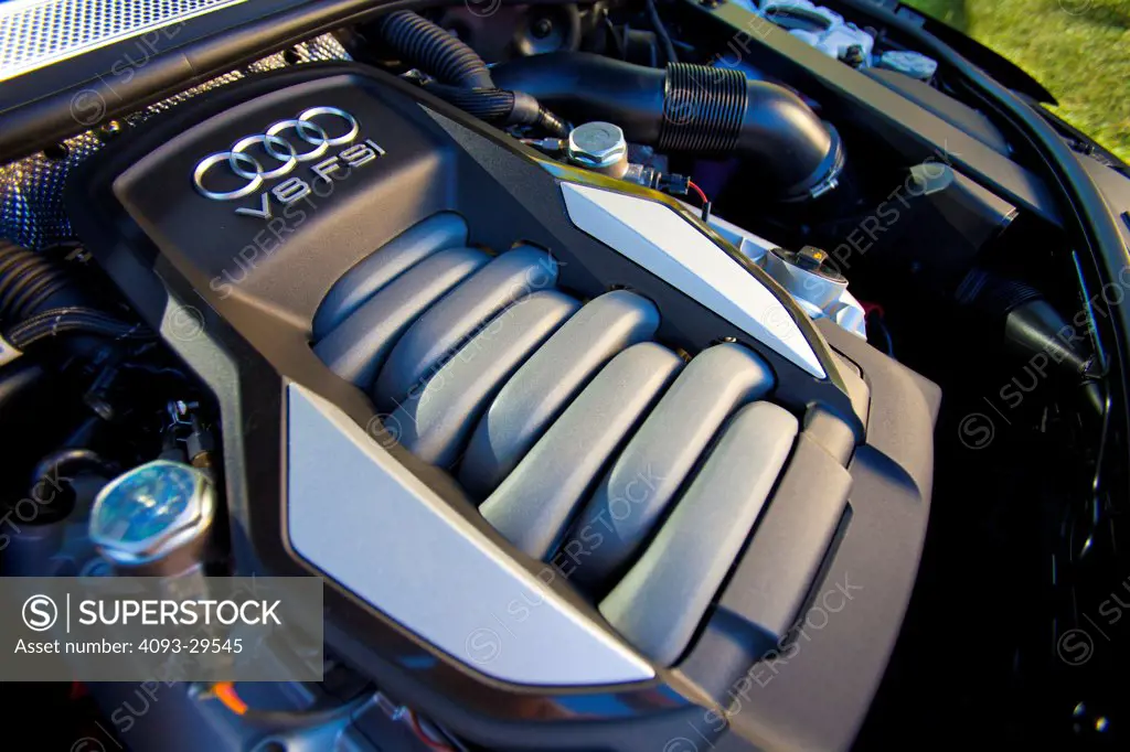 Engine view of a black 2012 Audi A8 showing the V8 FSI motor.
