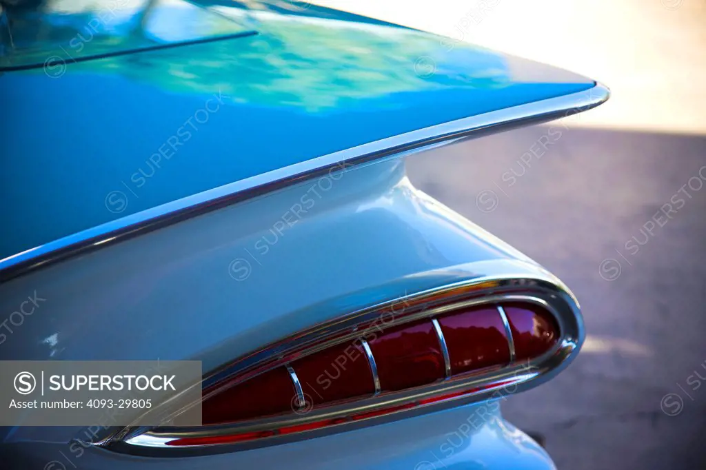 Exterior detail of a 1959 Chevrolet Impala showing the rear fin and tailight.