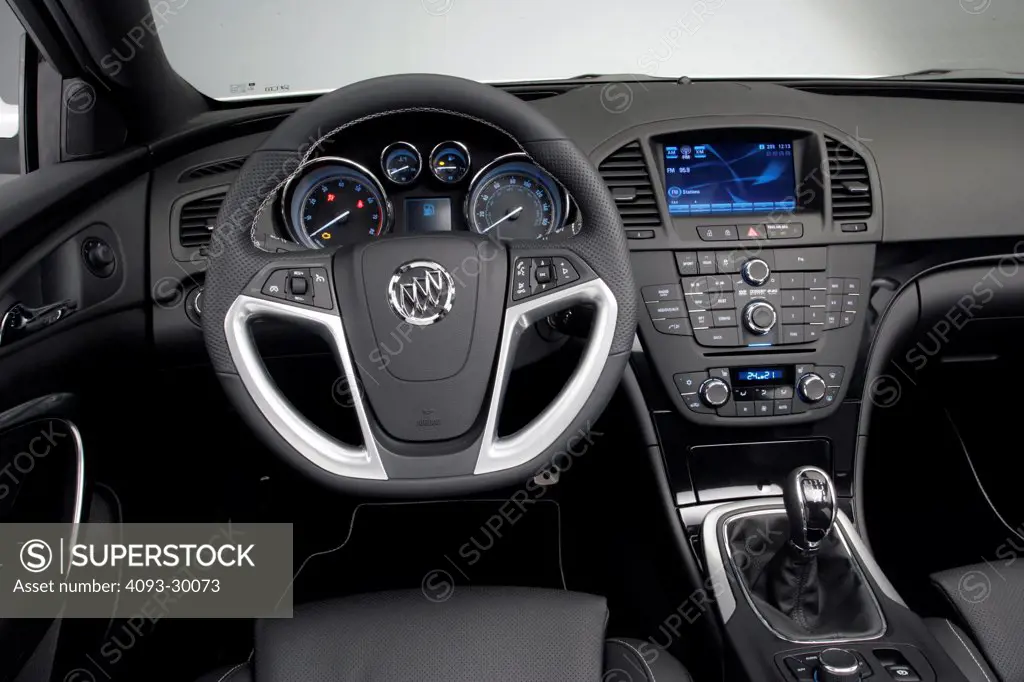 2011 Buick Regal GS Concept showing the steering wheel, instrument panel, dashboard, center console, gear shift lever and GPS navigation system
