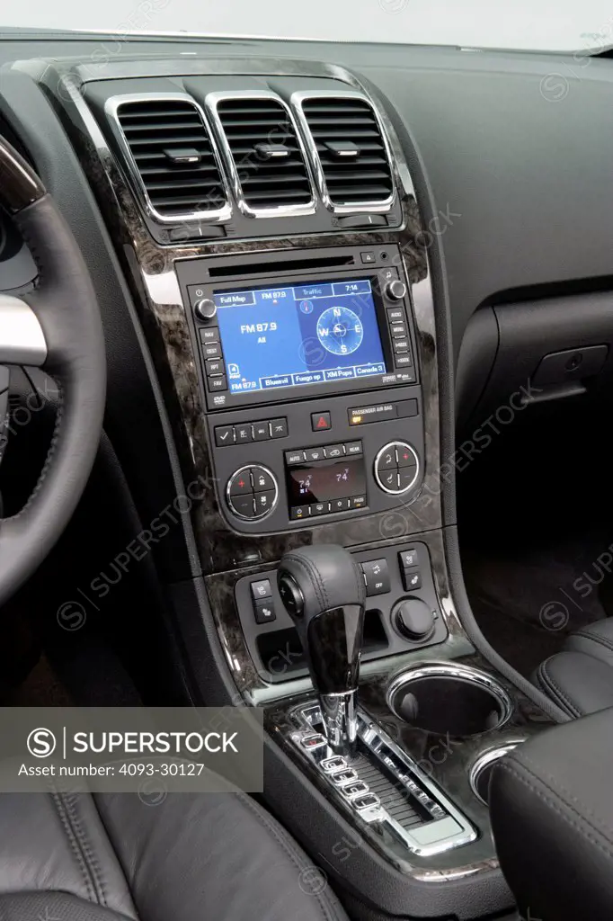2011 GMC Acadia Denali showing the center console and GPS navigation system
