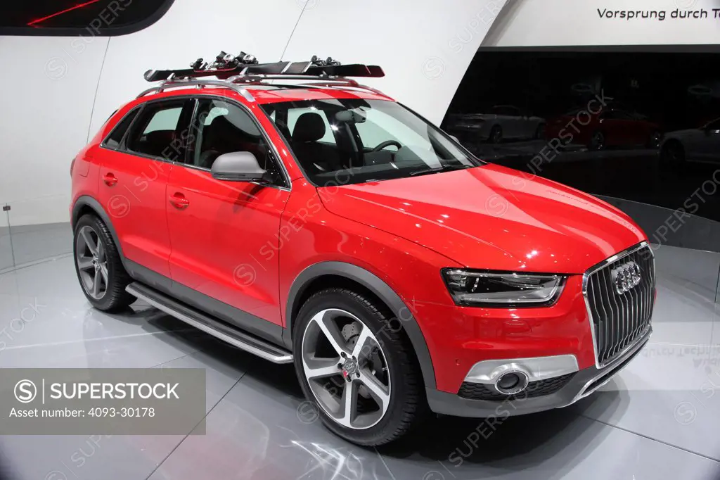 Front 3/4 static of a red 2013 Audi Q3 Vail Crossover at the 2012 Detroit International Auto Show.