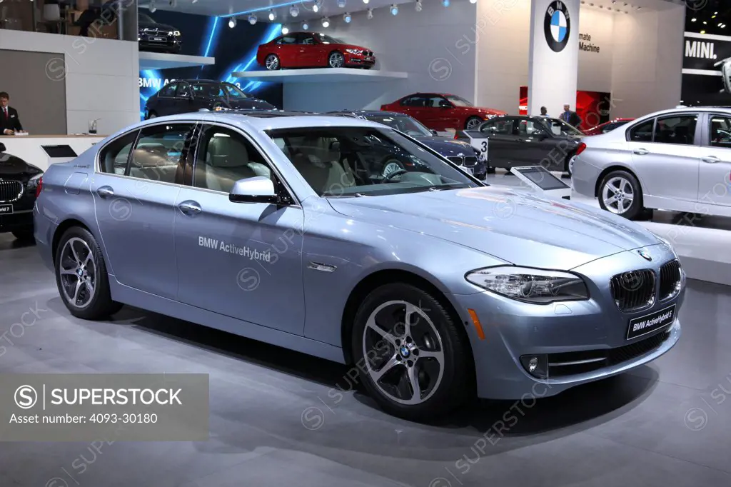 Front 3/4 static of a blue 2013 BMW 5-Series ActiveHybrid hybrid sedan at the 2012 Detroit International Auto Show.