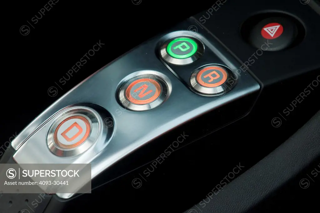 2010 Tesla RS Roadster interior showing the center console, start, drive and park buttons.