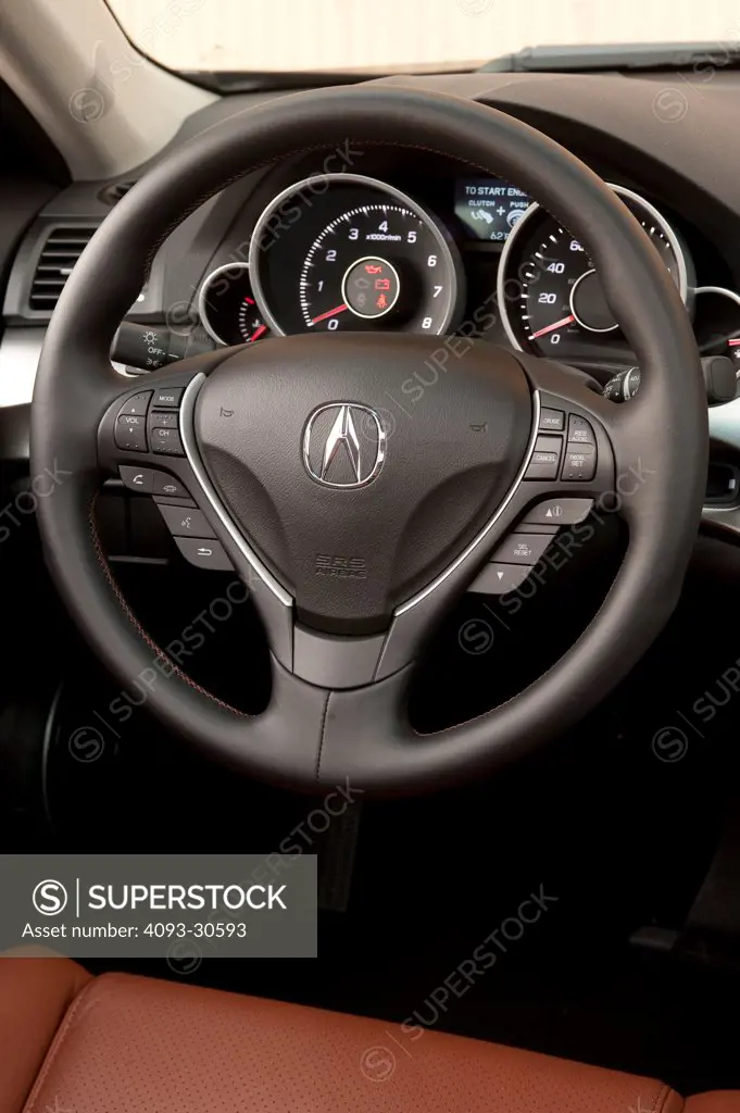 2011 Acura TL SH-AWD interior showing the steering wheel and instrument panel