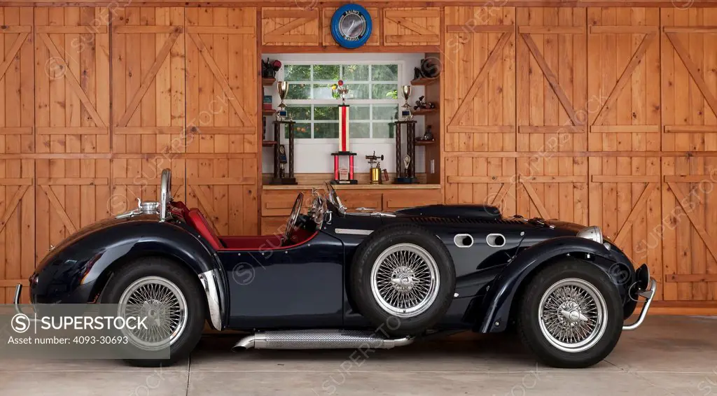 2011 BlueAllard J2xMkII Commemorative Edition parked in wood garage, profile static view