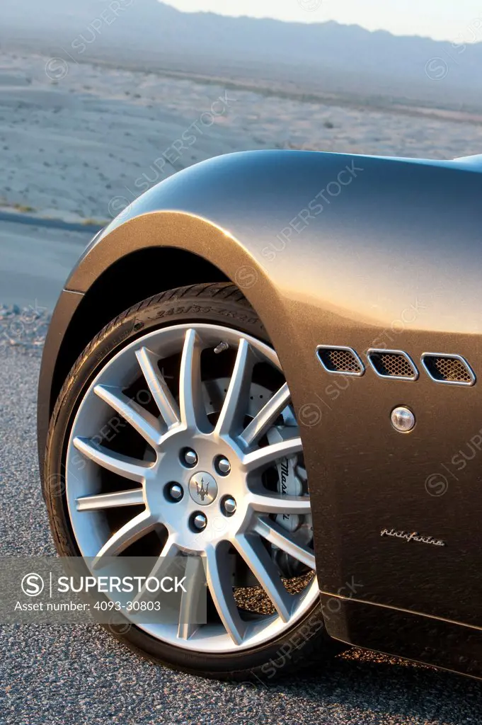 2011 Maserati GranCabrio showing the left front wheel tire, rim and left quarter panel