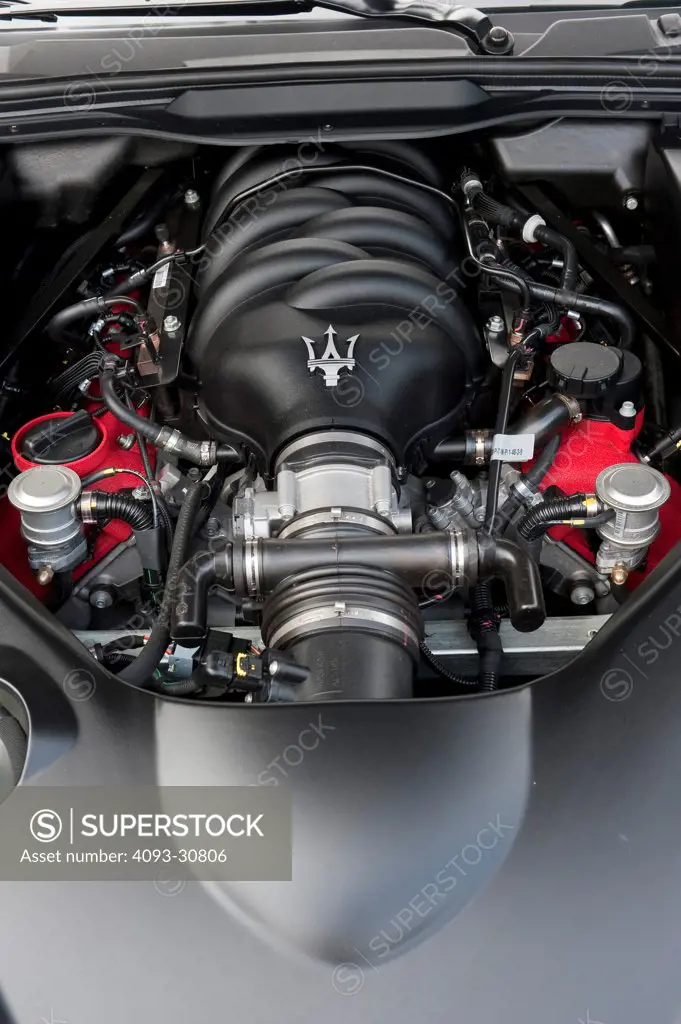 2011 Black Maserati GranCabrio showing the V8 engine motor, interior view