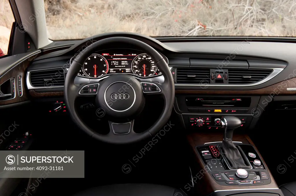 Interior detail view of the steering wheel and instrument panel of a 2012 Audi A7 3.0T