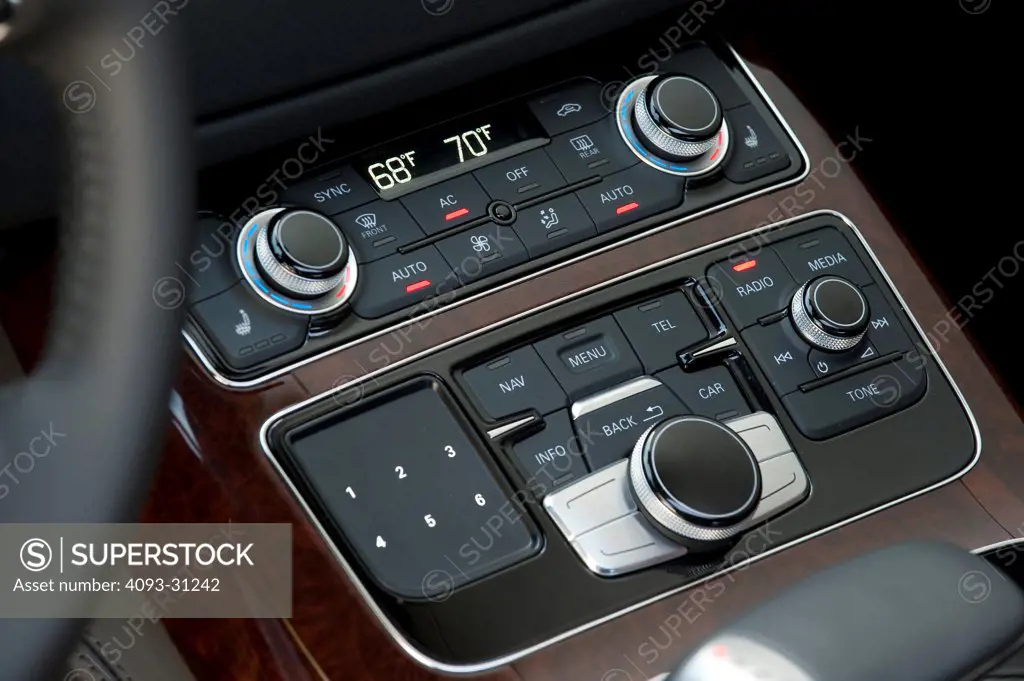 Close-up of the temperature and stereo controls of a 2012 Audi A8 L.