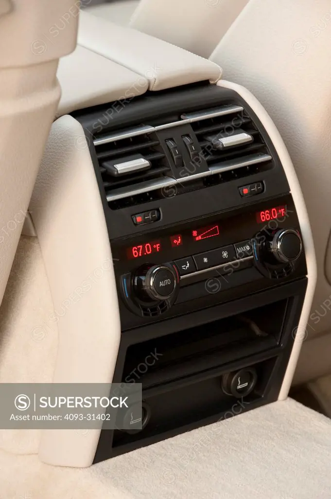 Interior detail of the rear console controls of a 2012 BMW 750Li