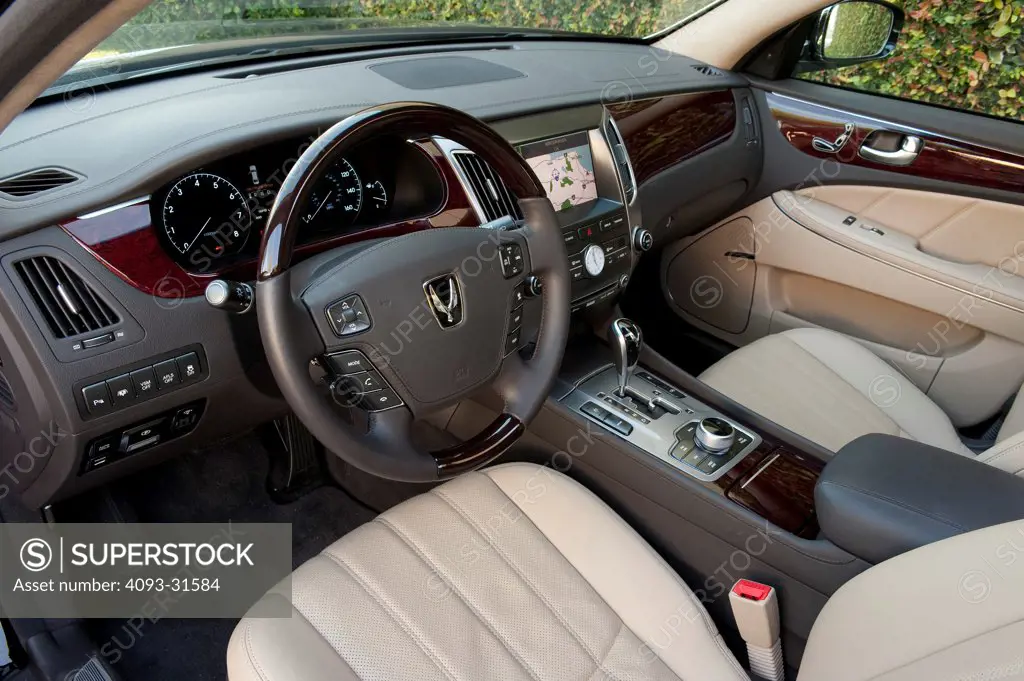 Interior view of the dash, steering wheel and seats of a 2012 Hyundai Equus