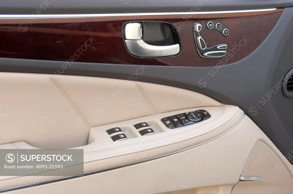 Detail of the door handle and seat adjustments of a 2012 Hyundai Equus