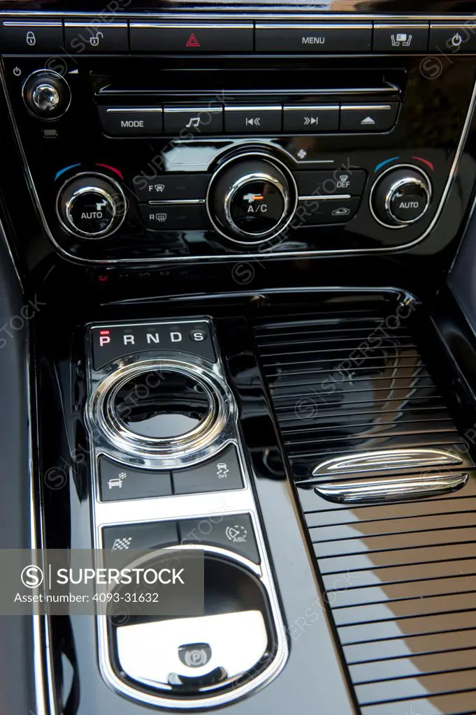 Detail of the 2012 Jaguar XJL showing the gear shift knob and the stereo.