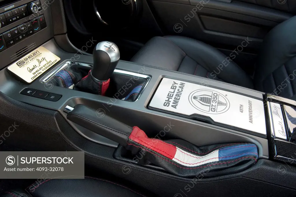 Detail of the shifter and emergency brake of a 2011 Ford Mustang Shelby GT350 45th Anniversary Edition